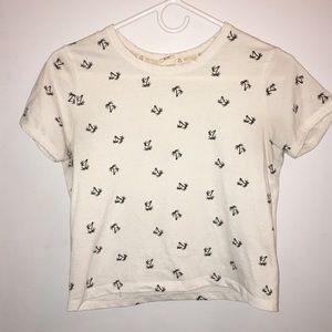 A white palm tree print crop top